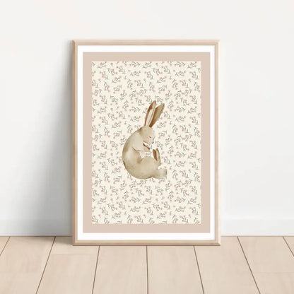 A framed bohemian style wall art set featuring a soft beige rabbit watercolor print with floral background