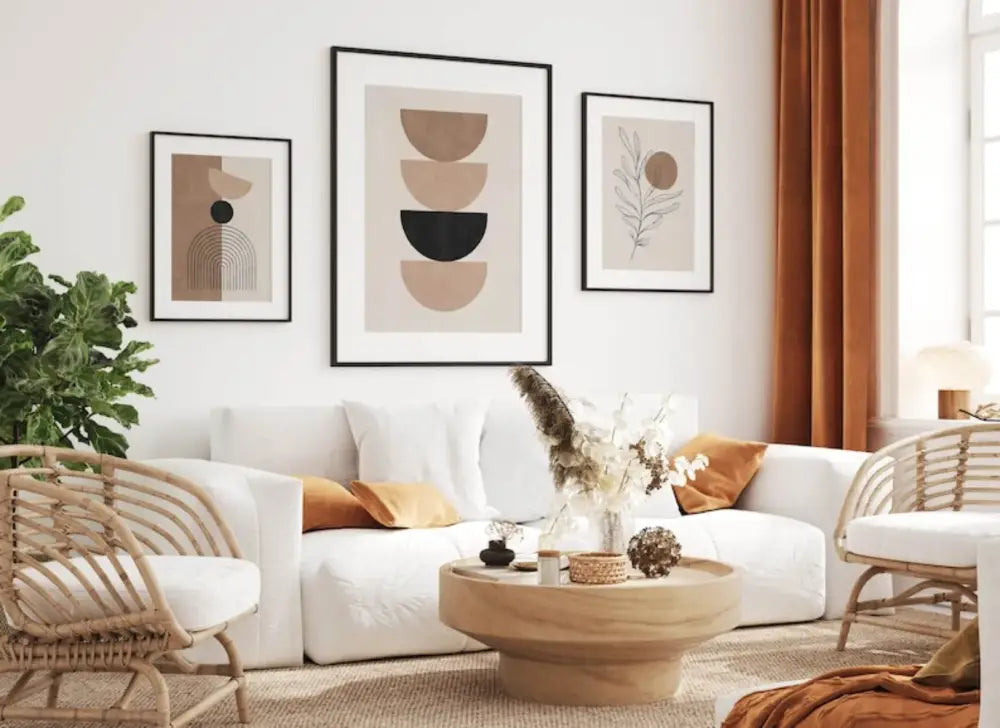 White sectional sofa with orange throw pillows next to decorbites™ bohemian geometric plant wall art set on wall