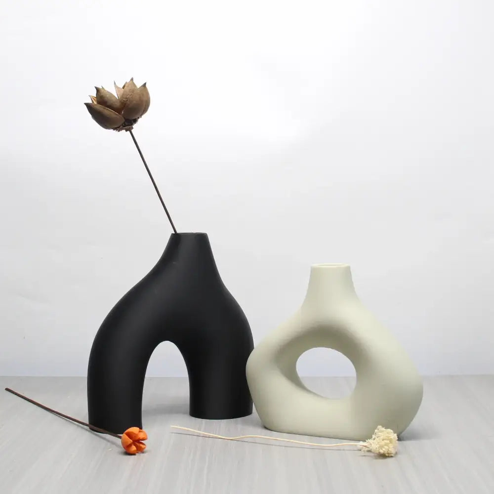 Black matte ceramic vase with unique arching shape and central opening from decorbites™ bohemian home decor vase set