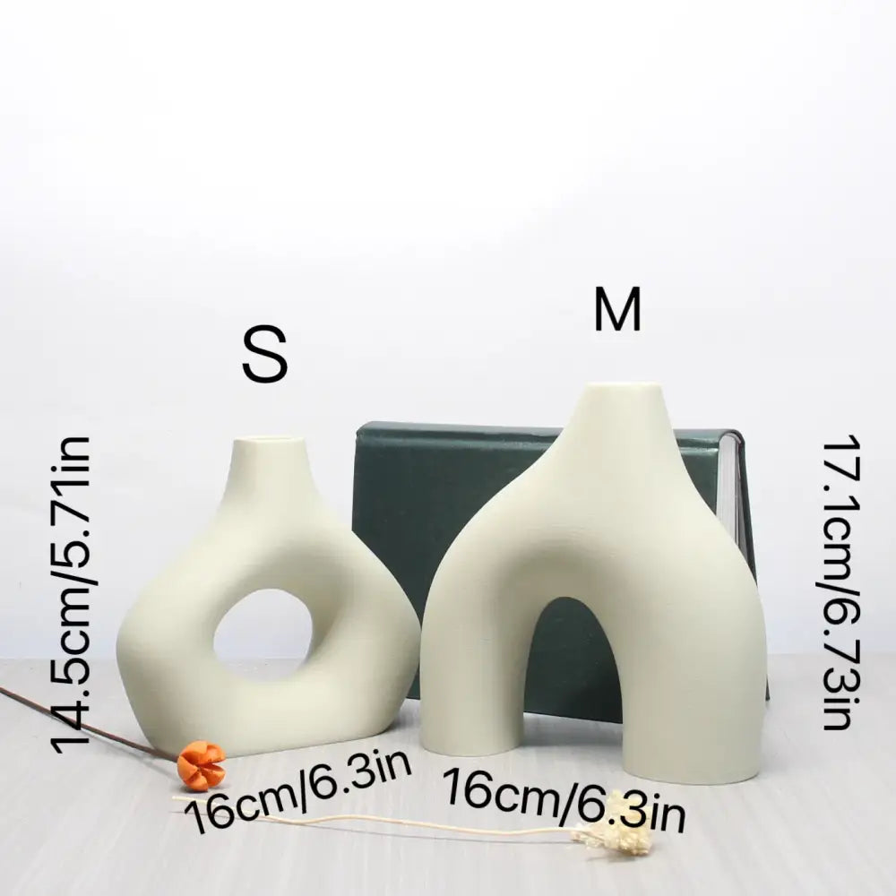 Cream-colored ceramic vase set with abstract organic shapes and central archway for bohemian home decor by decorbites