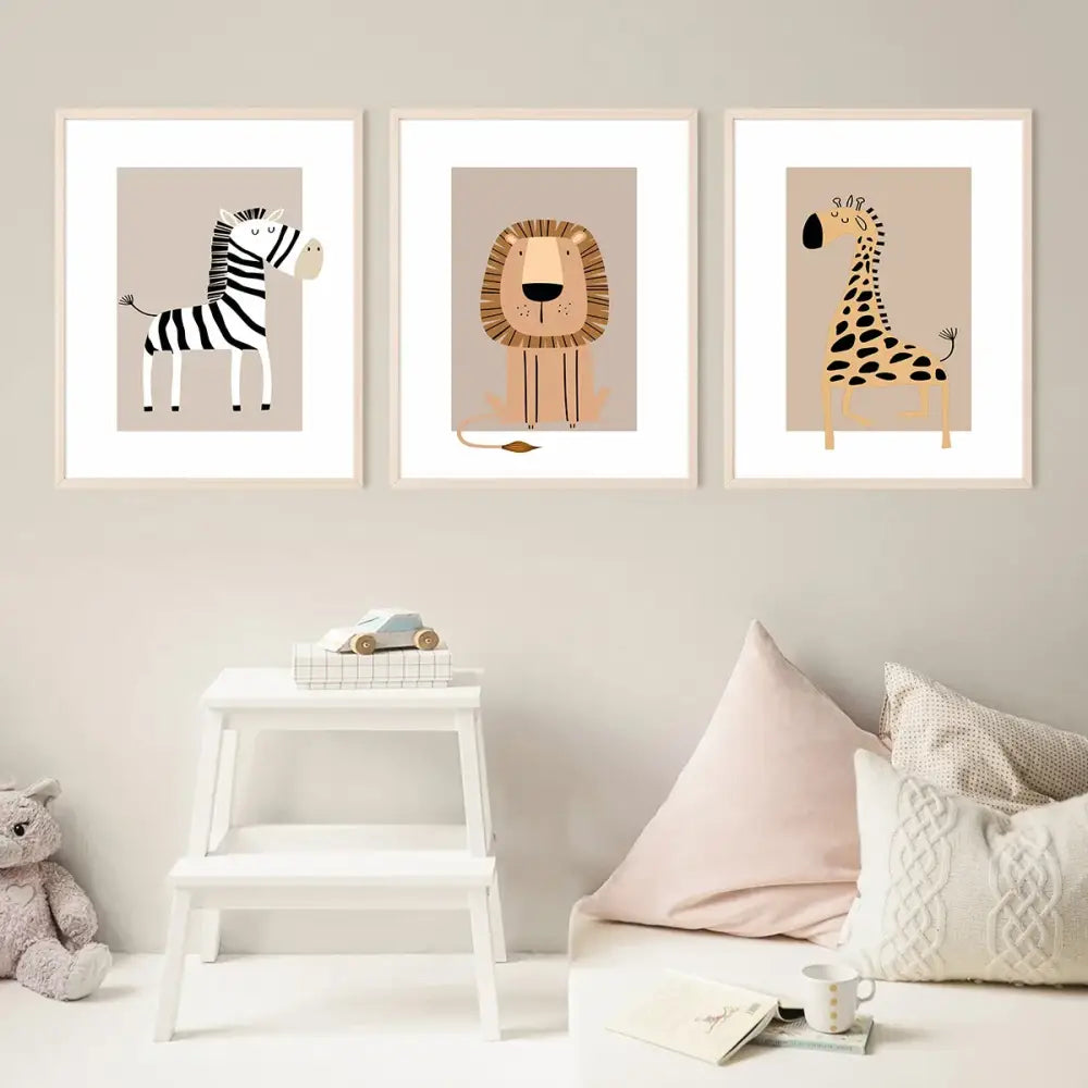 Set of three framed decorbites™ bohemian jungle animal toddler canvas prints featuring zebra lion and giraffe on beige background