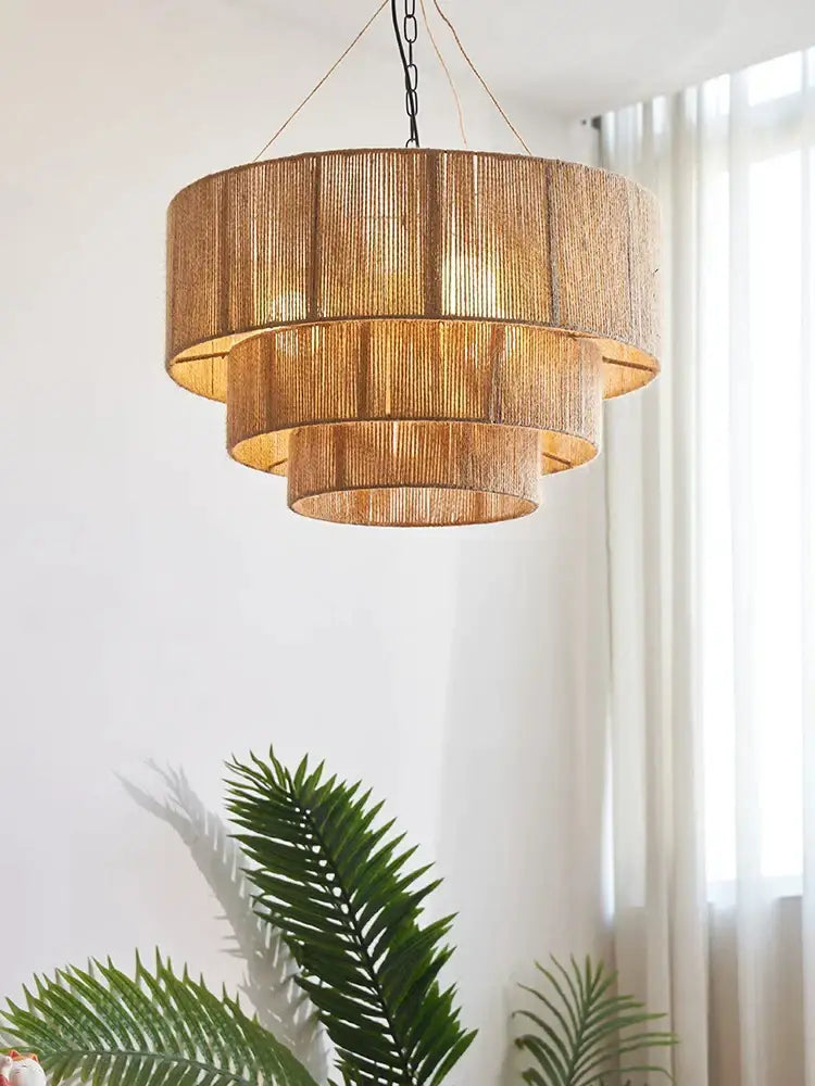 Decorbites bohemian rattan chandelier tiered bamboo dining room light with golden brown woven natural rattan texture and black chain suspension