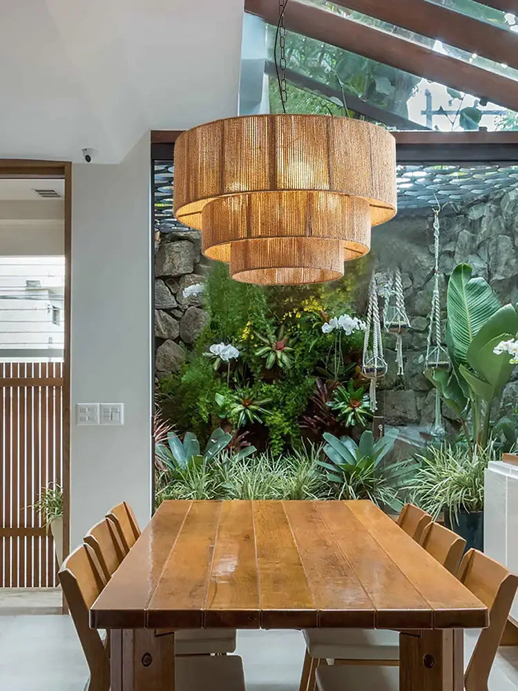 A warm tiered pendant light made of woven natural bamboo by decorbites bohemian rattan for dining rooms