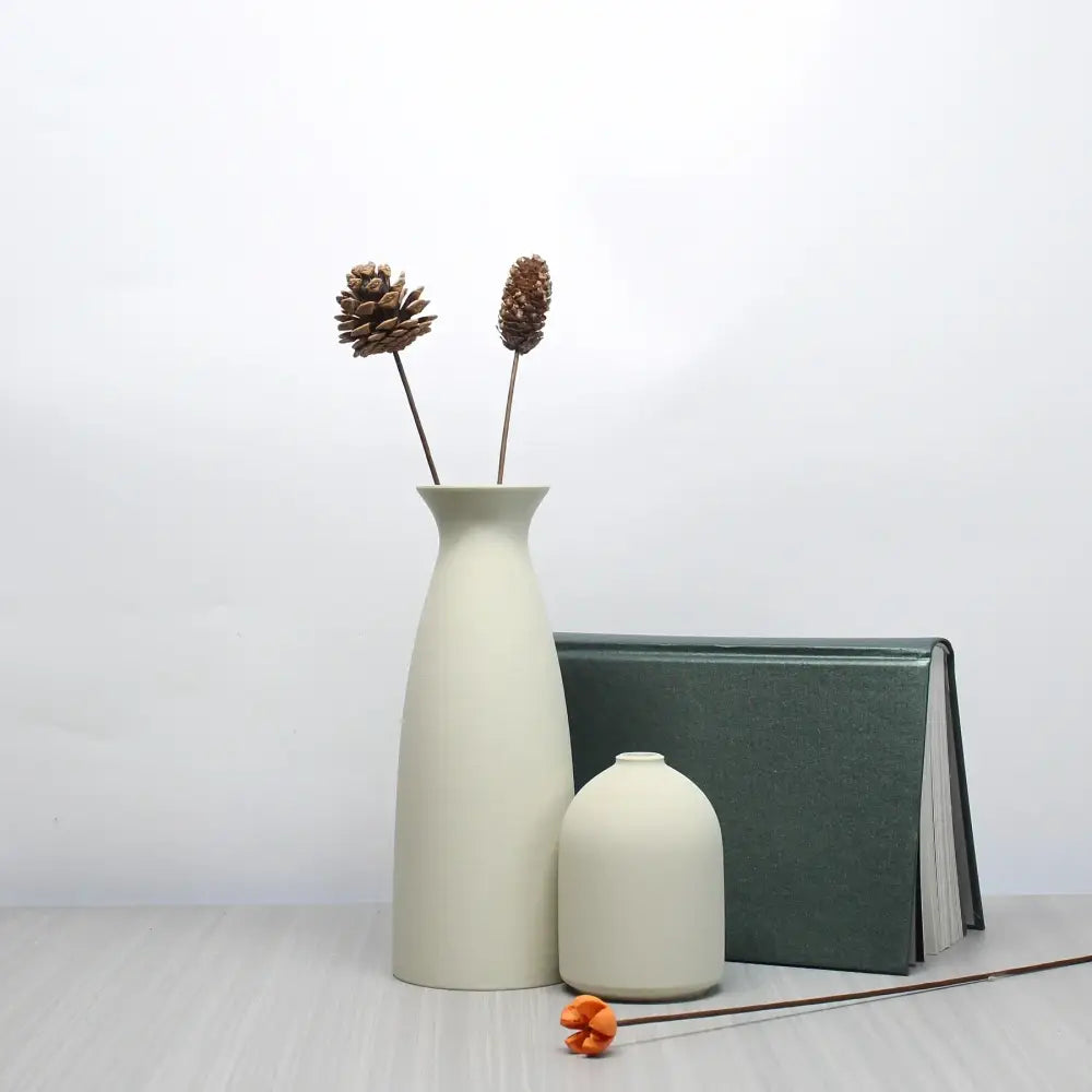 Cream-colored ceramic vase with slender neck and pinecones in decorbites™ bohemian style decorative vase set