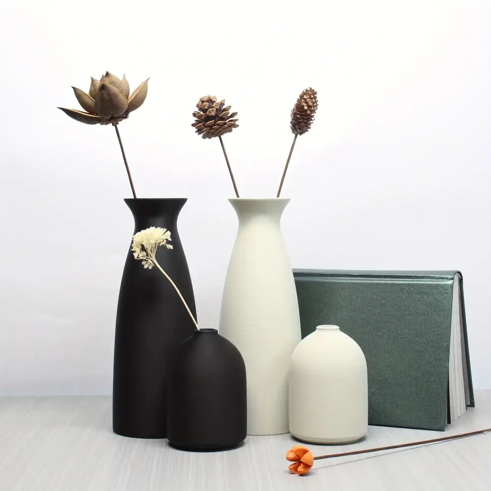 Set of minimalist matte black and off-white ceramic vases with sleek silhouettes in decorbites bohemian style decorative vase set