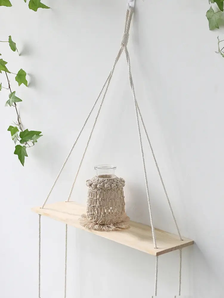 Beige DecorBites™ boho macrame wall shelf with light wood plank and natural fiber ropes for home decor