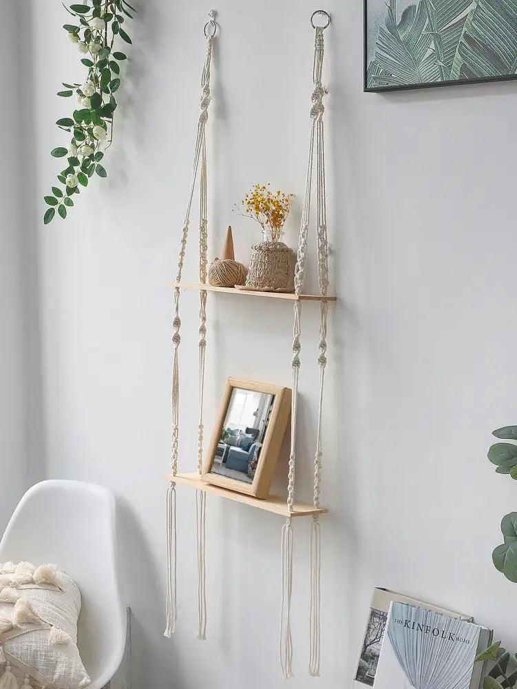 Beige boho macrame wall shelf with wooden slats and decorative knots for stylish home decor by DecorBites™
