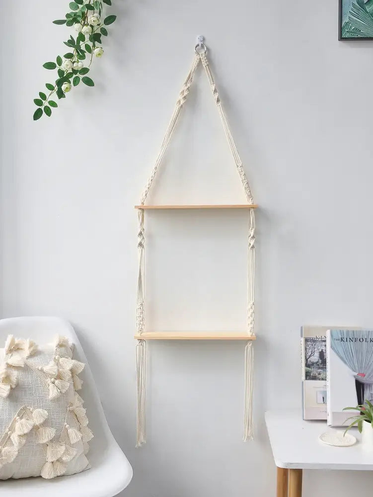 Beige decorbites™ boho macrame wall shelf with light wood shelves and decorative knots for home decor use