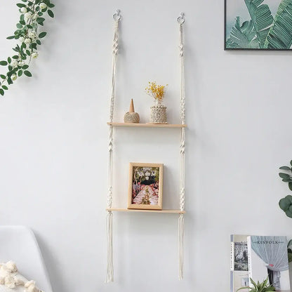 Cream-colored DecorBites™ boho macrame wall shelf with wooden slats and decorative knots for home decor