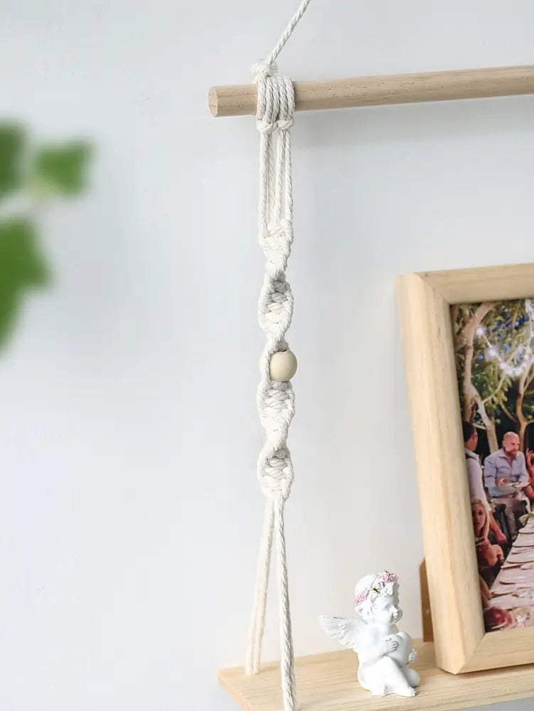 Decorbites™ boho macrame wall shelf in off-white with delicate hanging design and single wooden bead for home decor
