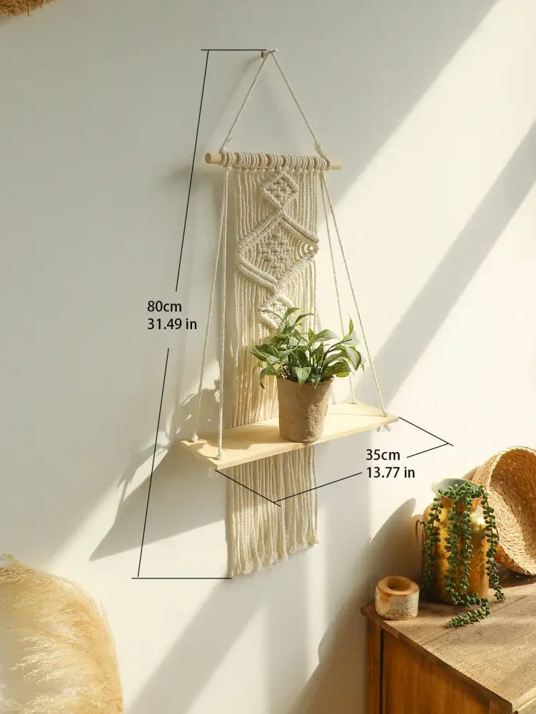 Beige macrame hanging shelf with wooden wall shelf and plant pot by decorbites™ boho home decor