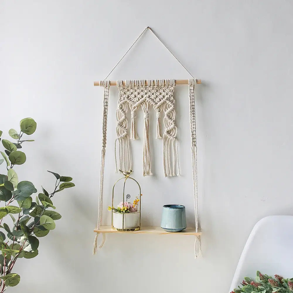 Beige macrame hanging shelf with wooden dowel tassels and integrated shelf for decorative items wall shelf home decor