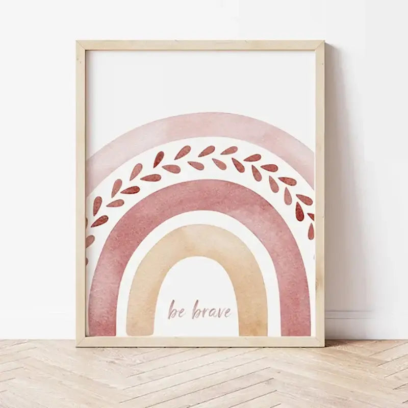 A framed decorbites™ boho rainbow sunshine nursery poster with soft pink beige terracotta hues and leafy wreath design