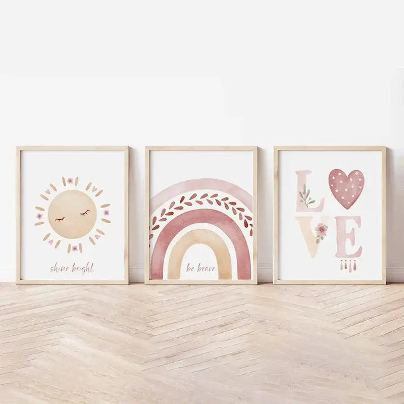 Three framed watercolor prints in pastel pink beige and mauve featuring boho rainbow sunshine nursery art by decorbites