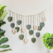 DecorBites™ boho style handmade tapestry with green and cream macrame leaves on wood dowel for living room decor