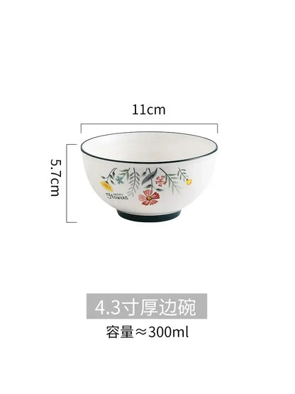 White ceramic rice noodles bowl from decorbites bone china set with delicate floral pattern and black trim accents