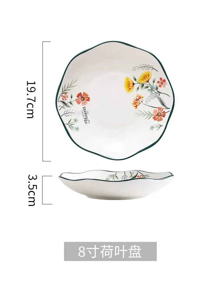 White ceramic bone china dinner plate with scalloped edge and hand-painted yellow and pink flowers for rice noodles bowl use