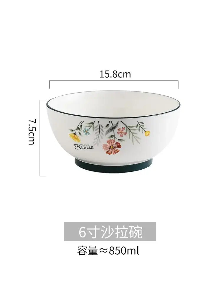White ceramic DecorBites™ bone china rice noodles bowl with floral rim design and black edge accents for serving noodles