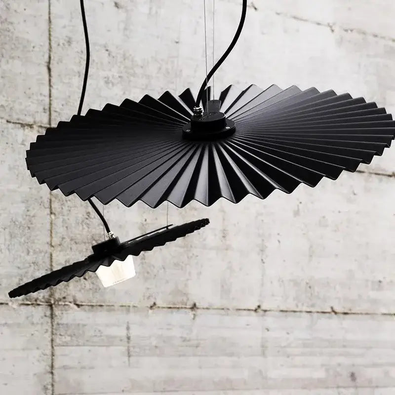 Black fan-shaped pendant light with metallic finish and segmented design from decorbites boomerang wood chandeliers