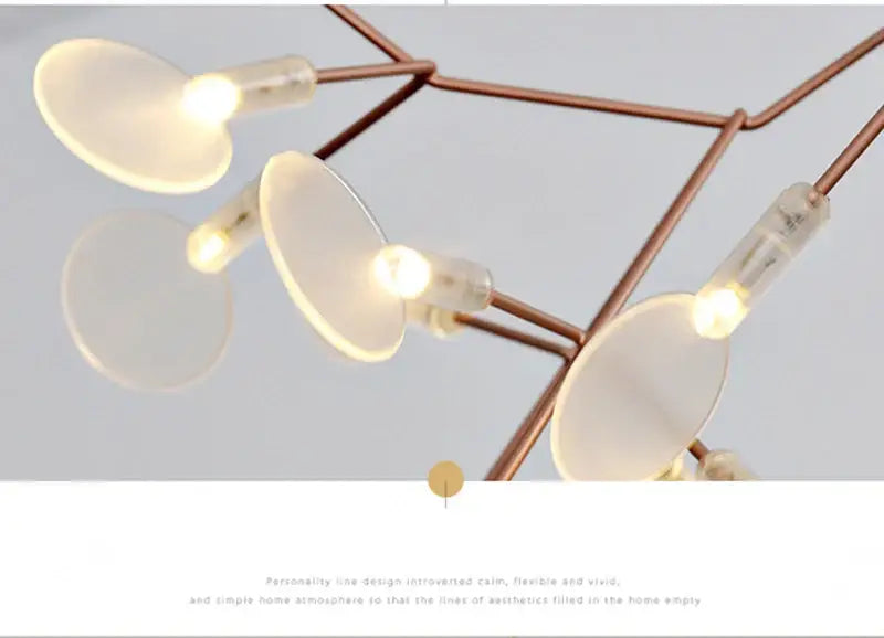 Copper-toned decorbites™ branch design nordic chandelier with translucent disc-shaped fixtures in rose gold black