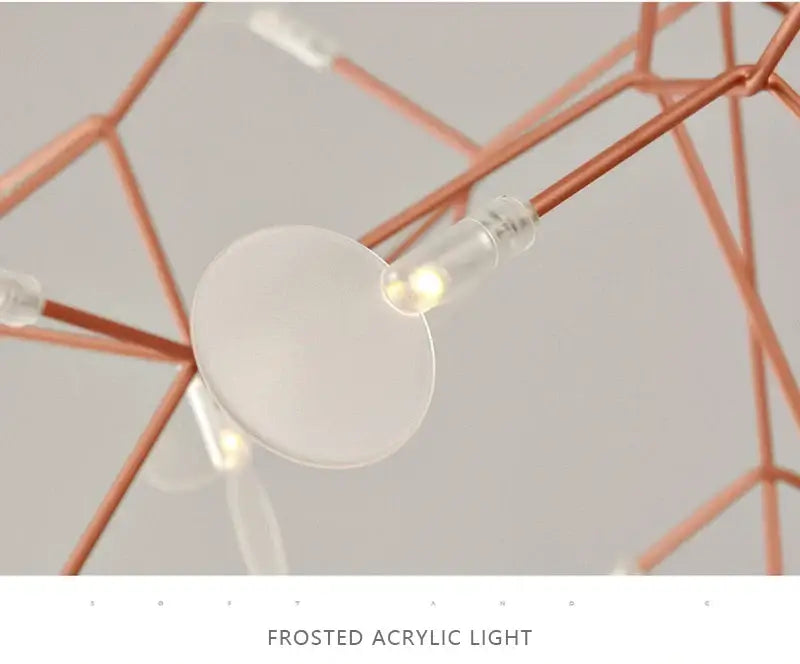 Frosted acrylic light with warm glow suspended from copper-toned rods in decorbites branch design rose gold black chandelier