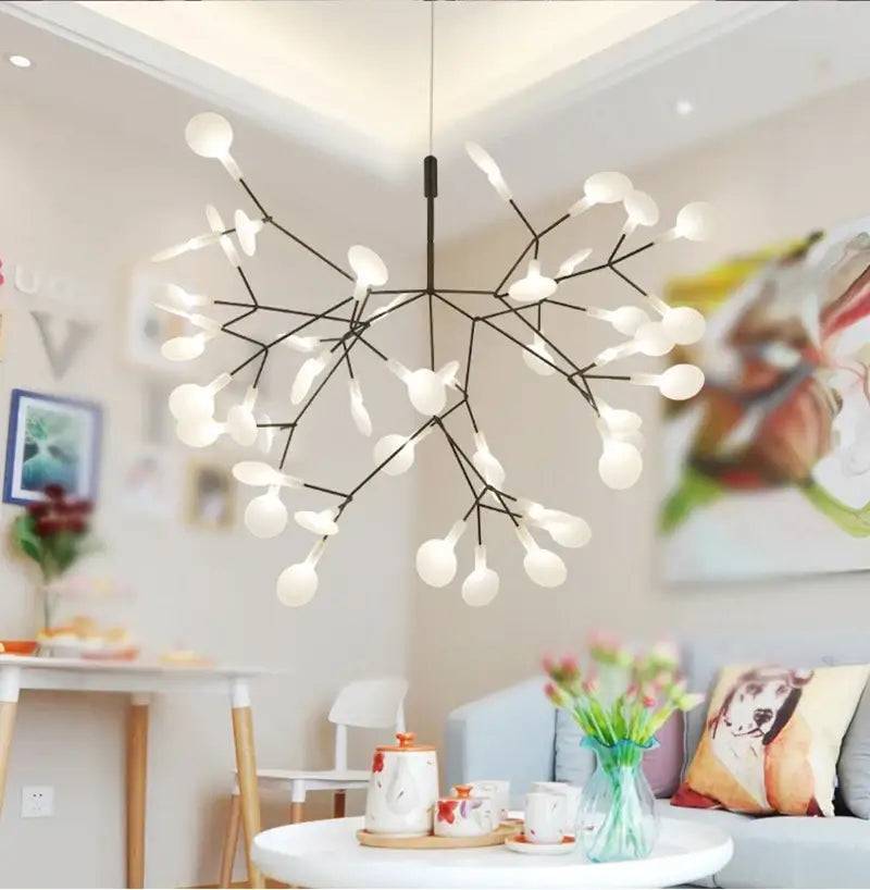 Modern black metal DecorBites branch design chandelier with delicate arms and frosted globes in rose gold black finish