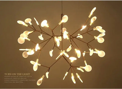 A modern minimalist branch design chandelier by decorbites with rose gold black metal frame and frosted glass bulbs