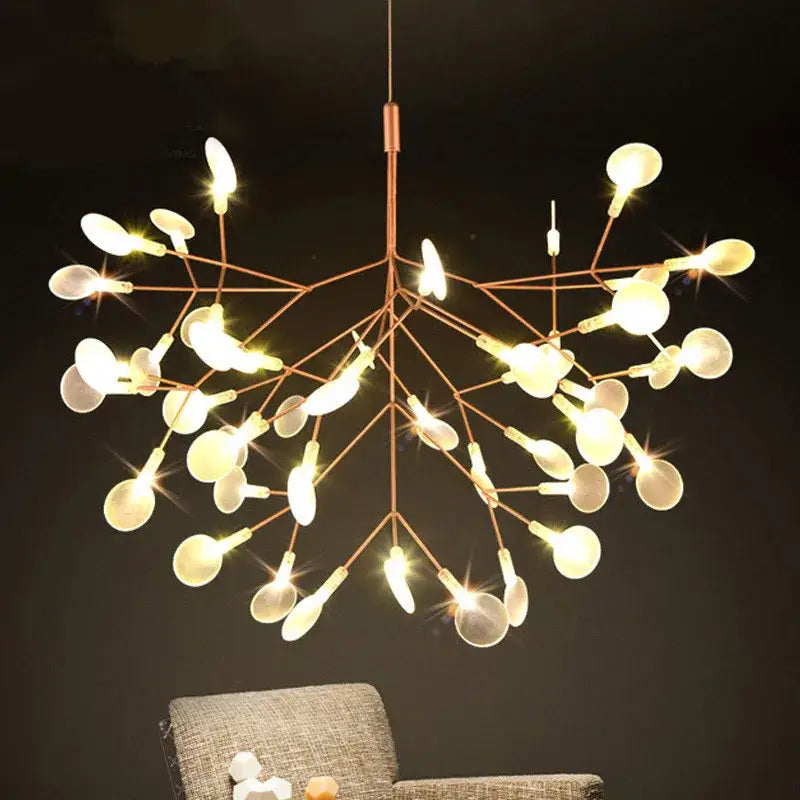 A modern DecorBites™ branch design nordic chandelier in rose gold black with glowing spherical bulbs and copper tones