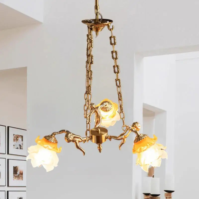 Decorbites brass angel chandelier with golden finish ornate chains and three flower-shaped glass shades for living room