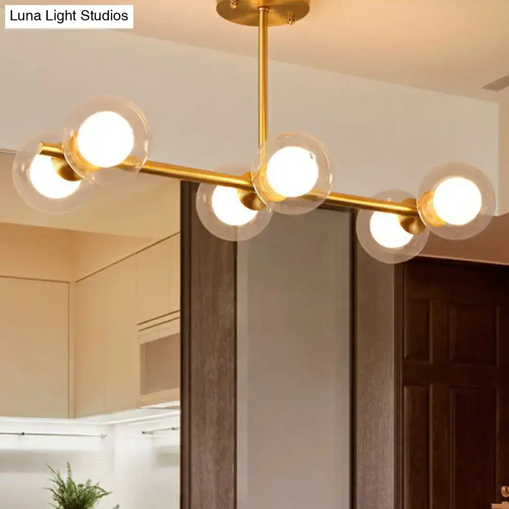Decorbites brass finish 6-light linear island pendant with gold-toned frame and five white clear glass globe bulbs