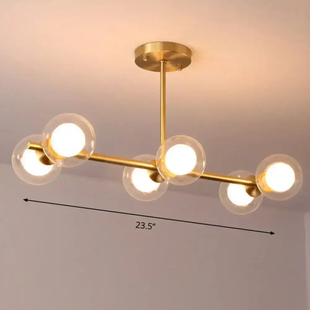 DecorBites brass finish 6-light linear island pendant with white clear glass ball shades and gold-toned fixture