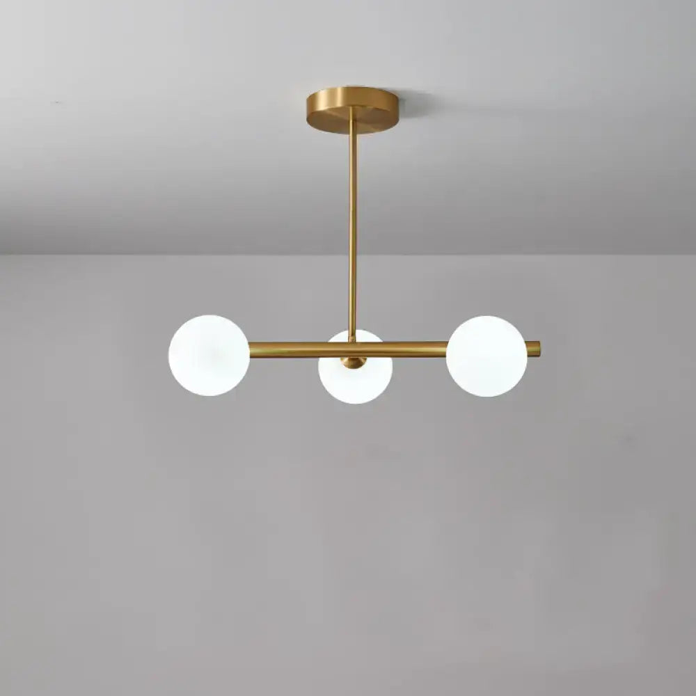 Modern brass DecorBites pendant ceiling light with three frosted glass globe bulbs for dining room lighting kit
