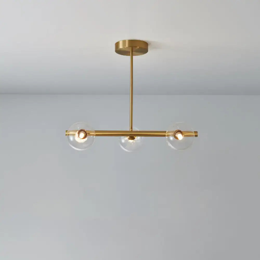 DecorBites™ brass island pendant light with gold-toned finish and three clear glass globes for dining room ceiling light