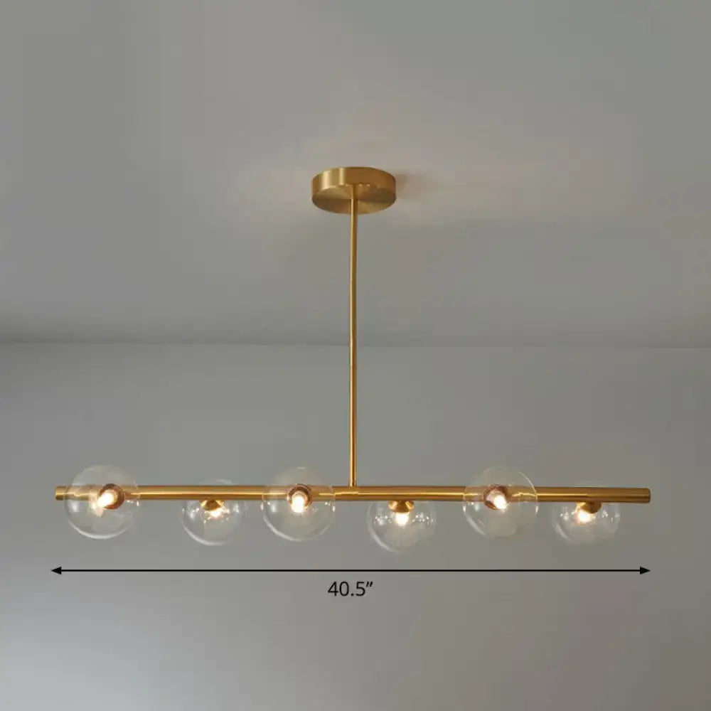 Decorbites brass plated glass sphere island pendant light with gold toned bar and clear white glass globe bulbs for dining room