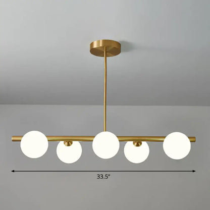 DecorBites brass plated sphere island pendant light with five clear white glass sphere island globe shades for dining room