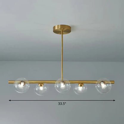 DecorBites brass plated glass sphere island pendant light with four clear white glass globe shades for dining room