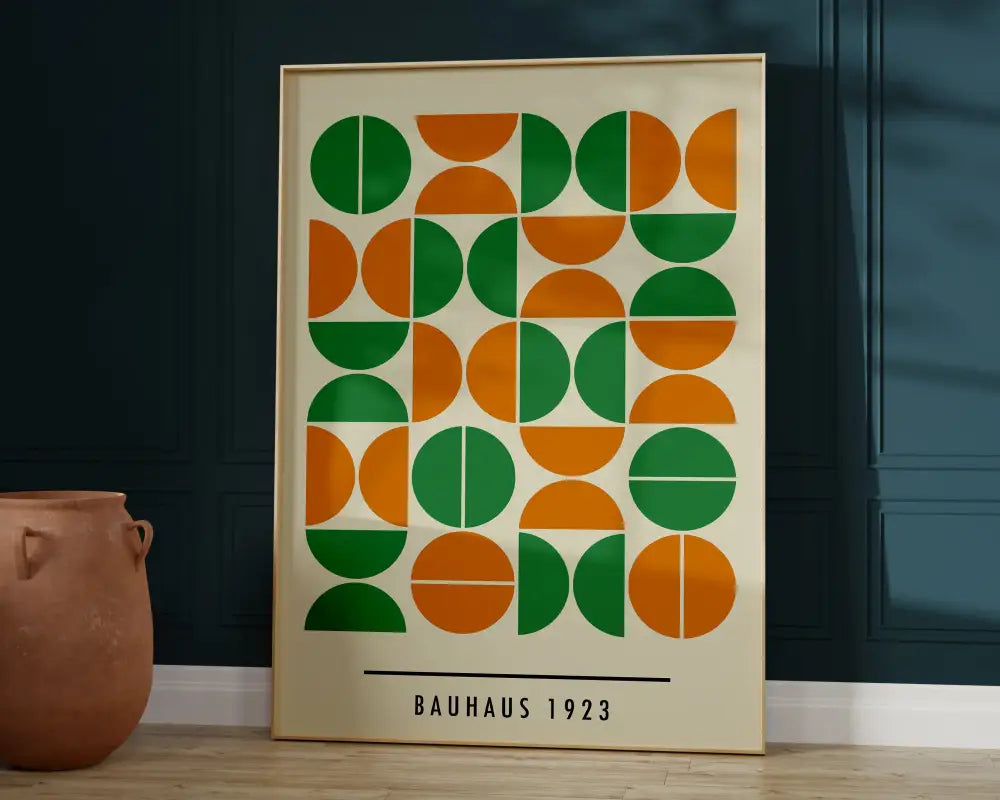 A framed bauhaus-inspired bright geometric canvas print with green and orange half-circles for home decor