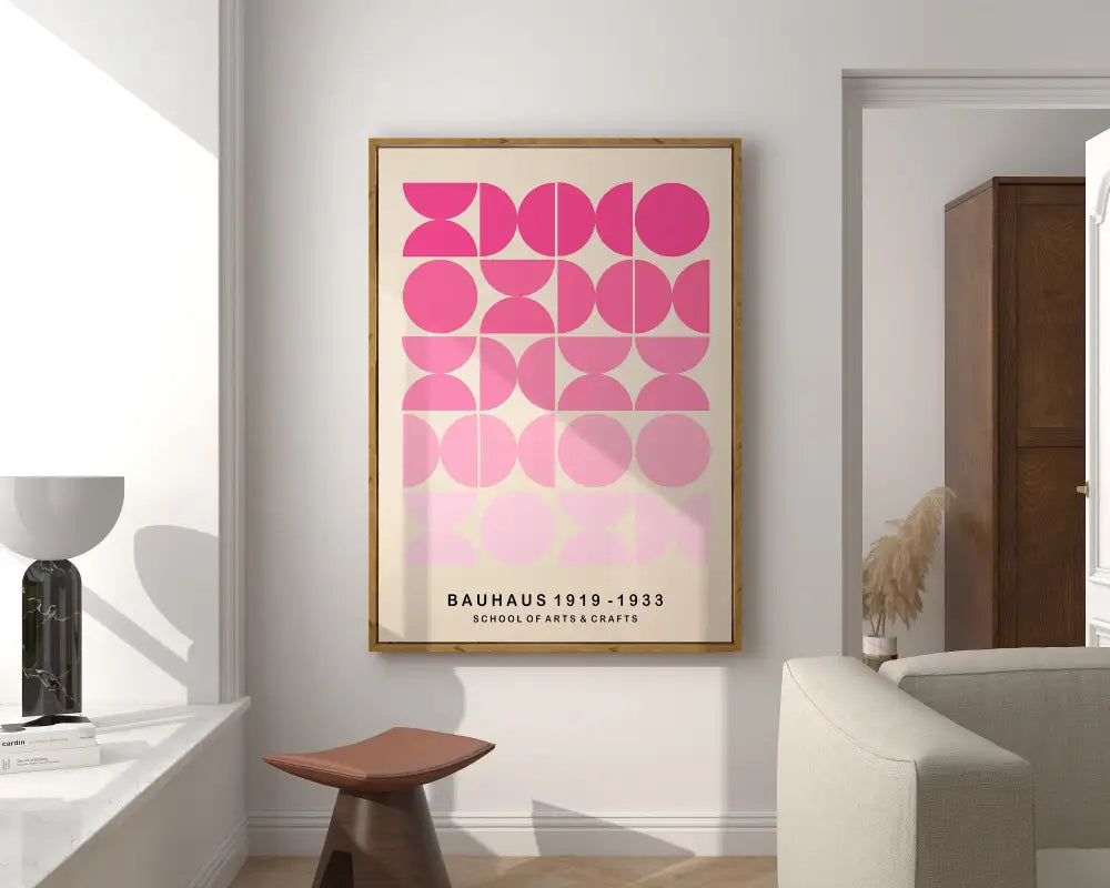 A framed bauhaus poster with bright geometric canvas featuring pink circles on off-white background for home decor