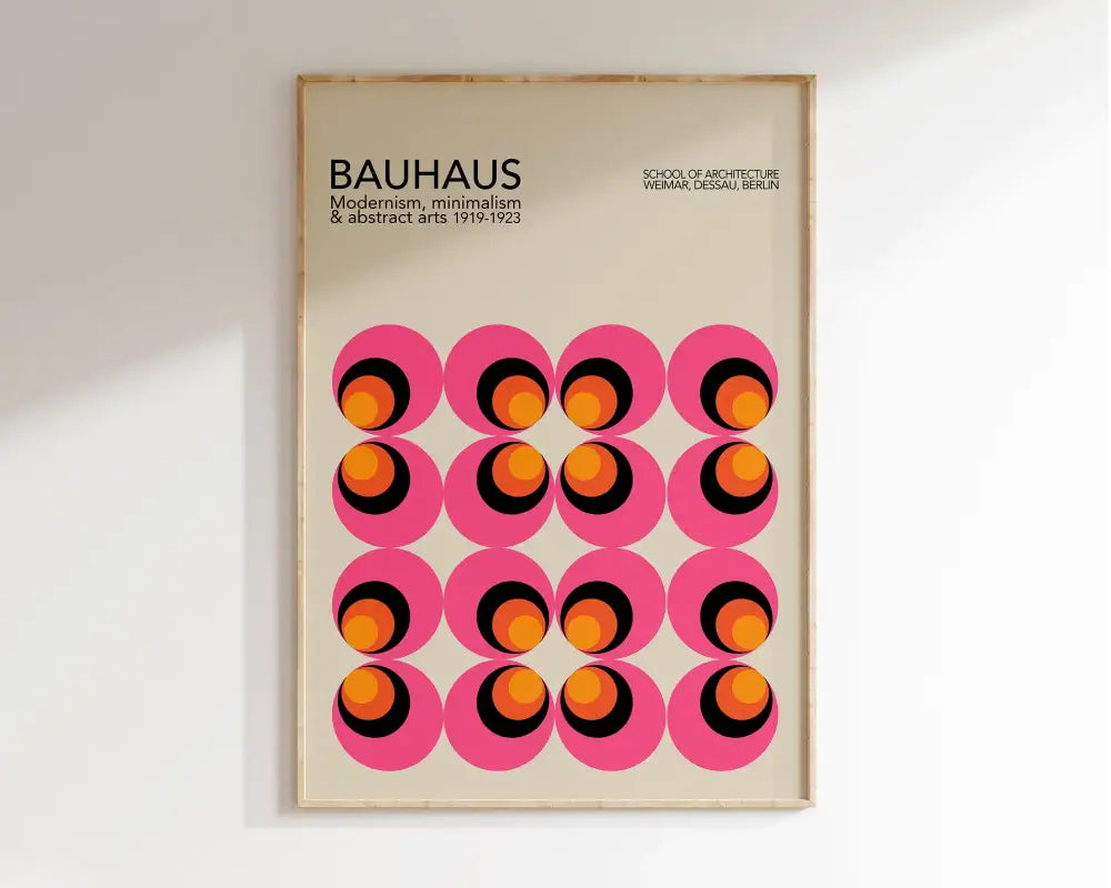 A framed DecorBites™ bright geometric canvas print with pink circles and orange black rings for home decor