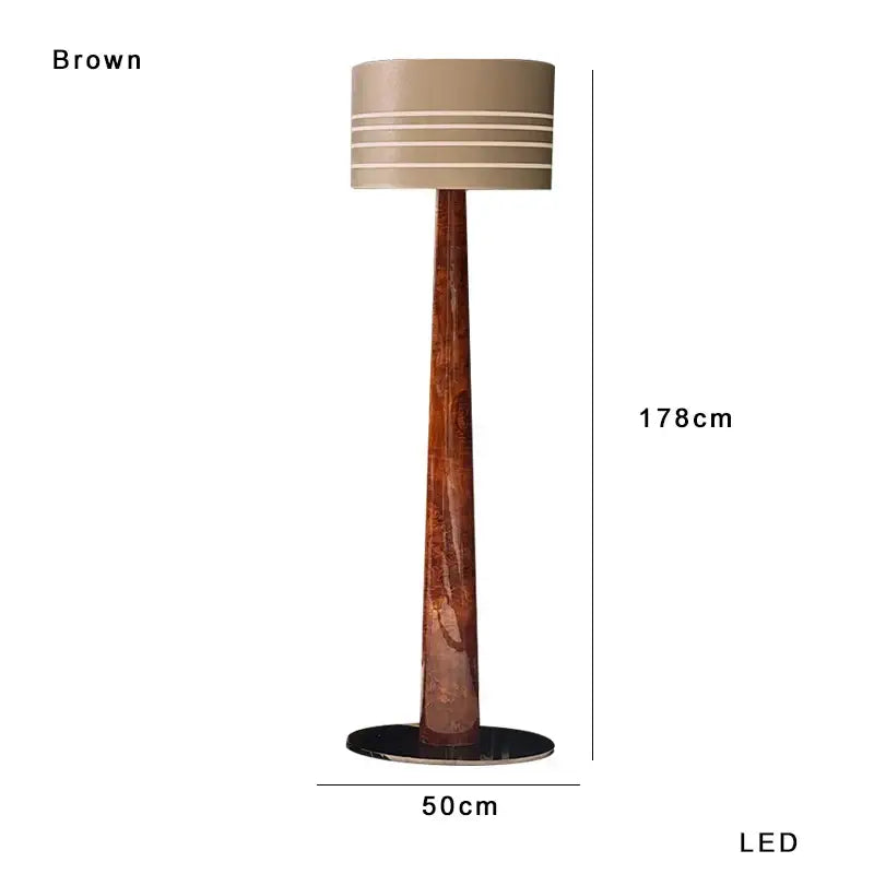 Brown leather wooden floor lamp by decorbites with a tall wooden base and beige striped drum shade for living room