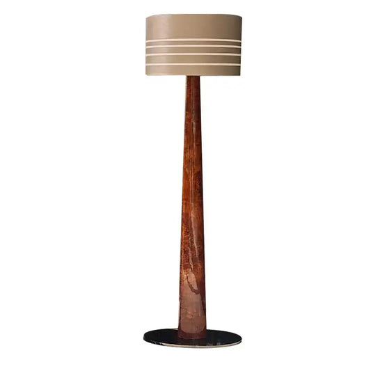 Tall floor lamp with slender textured copper base and beige drum shade in decorbites brown leather wooden style