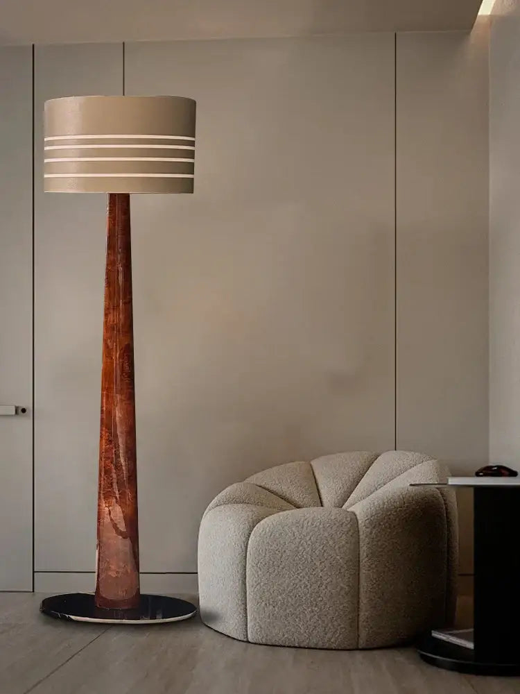 Decorbites brown leather wooden floor lamp with cylindrical beige shade and textured copper base for living room