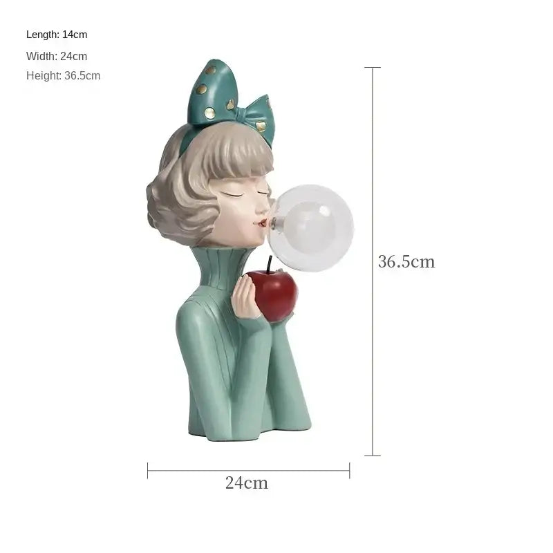 Teal resin decorbites bubble girl figurine with short blonde hair blowing a bubble holding a red apple night light