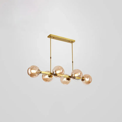 Gold-toned DecorBites™ Bubbles pendant light features five frosted glass globe bulbs in a linear modern design