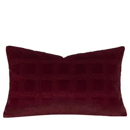 A decorbites burgundy velvet bed runner with a rich quilted grid pattern and geometric embroidered design