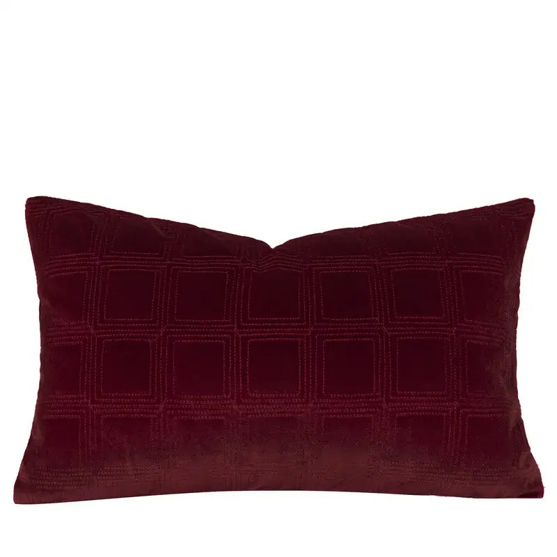 A decorbites burgundy velvet bed runner with a rich quilted grid pattern and geometric embroidered design