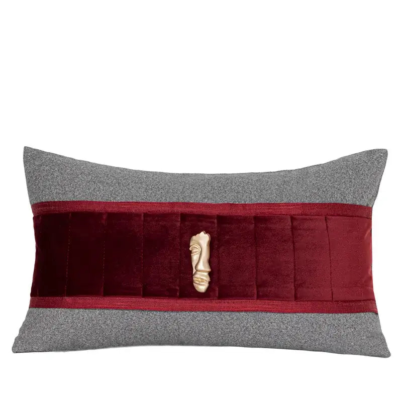 Rectangular cushion with gray woolen top and burgundy velvet pleated band featuring ivory sculpted face decorbites bed runner
