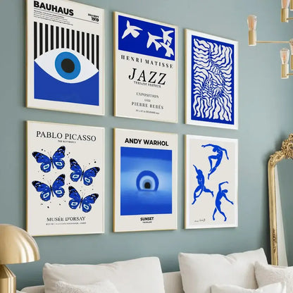 Six framed blue and white bold art prints including bauhaus and matisse in a butterfly botanical canvas for living room decor