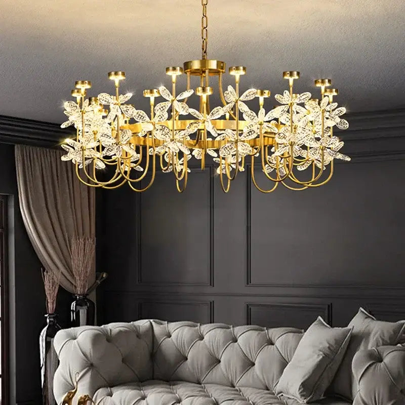 Gold-toned decorbites butterfly chandelier with intricate crystal flower designs for elegant dining room lighting