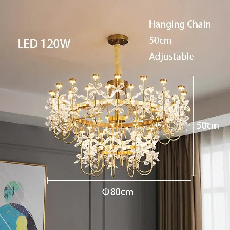 Gold-toned decorbites butterfly chandelier featuring intricate crystal flower designs and led lighting for dining room use